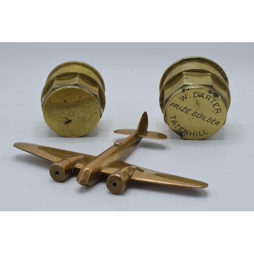 278 - Antique brass hub caps, one named 'W. Carter Prize Builder Tatenhill', together with a trench art pl... 