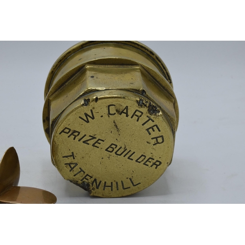 278 - Antique brass hub caps, one named 'W. Carter Prize Builder Tatenhill', together with a trench art pl... 