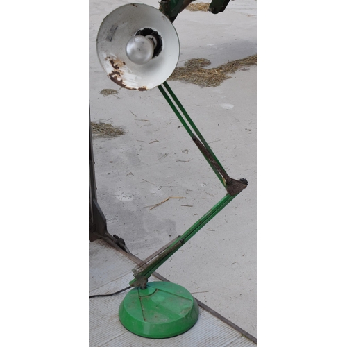 281 - A vintage 20th century green anglepoise lamp with round base, approx 95cm tall at tallest. Untested.