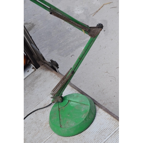 281 - A vintage 20th century green anglepoise lamp with round base, approx 95cm tall at tallest. Untested.