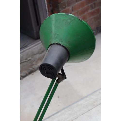 281 - A vintage 20th century green anglepoise lamp with round base, approx 95cm tall at tallest. Untested.