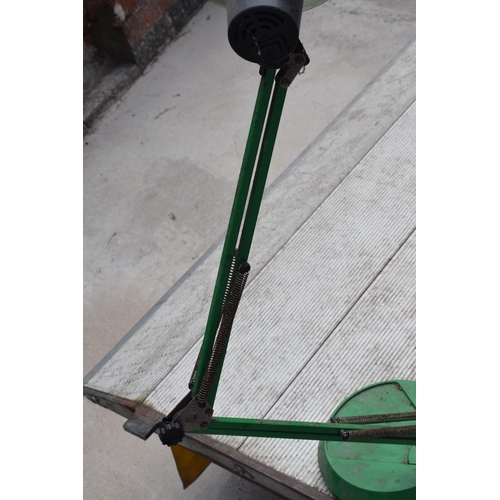 281 - A vintage 20th century green anglepoise lamp with round base, approx 95cm tall at tallest. Untested.