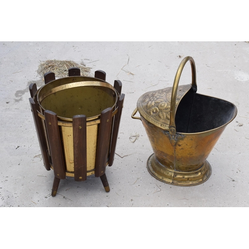 282 - A late 19th century embossed copper coal bucket together with a 20th century wooden and brass exampl... 