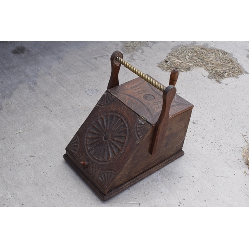 283 - Victorian wooden coal scuttle with brass handle and brass shovel with carved decoration '1888' to th... 