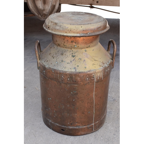 284 - An early 20th century copper milk churn 'Daw's Creameries' complete with lid, 52cm tall.