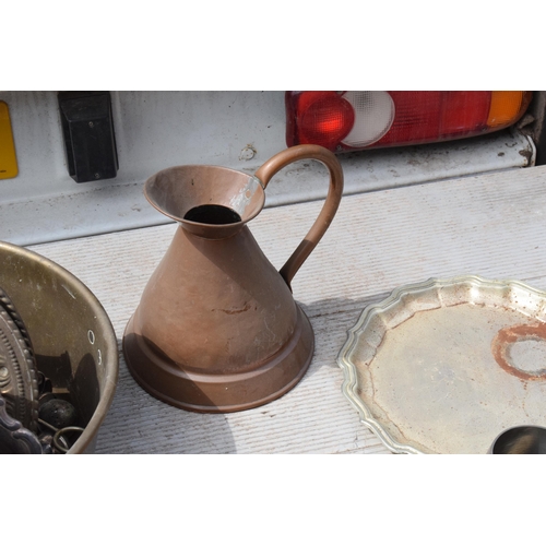 285 - A collection of metalware to include Victorian copper jug and later brass pans, plaques, tankards et... 