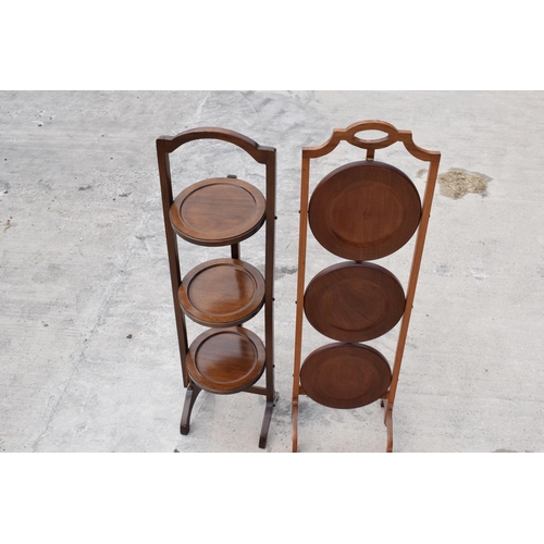 294 - A pair of mid 20th century wooden lazy waiter/ folding 3 tiered stands (2). 92cm tall.