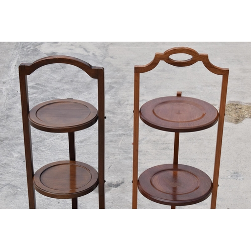 294 - A pair of mid 20th century wooden lazy waiter/ folding 3 tiered stands (2). 92cm tall.