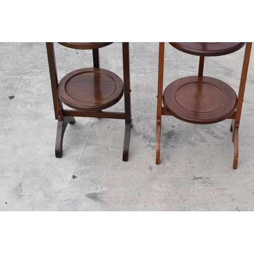 294 - A pair of mid 20th century wooden lazy waiter/ folding 3 tiered stands (2). 92cm tall.