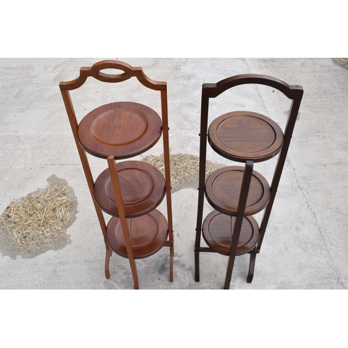 294 - A pair of mid 20th century wooden lazy waiter/ folding 3 tiered stands (2). 92cm tall.