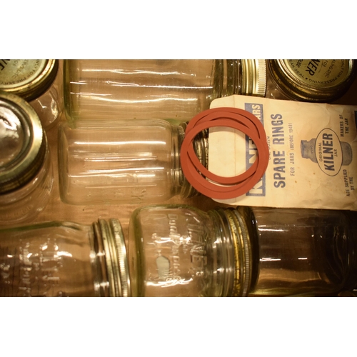 302 - A collection of vintage Kilner glass jars with metal lids together with spare seals / rings (approx ... 