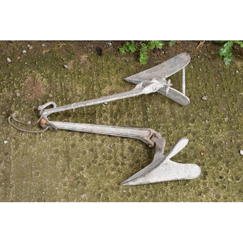 328 - A vintage cast metal pair of ship's anchors, 51cm long (2).