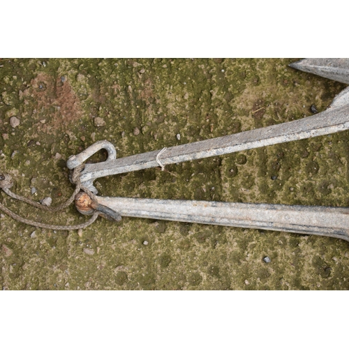 328 - A vintage cast metal pair of ship's anchors, 51cm long (2).