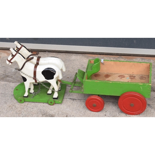 333 - A pair of vintage 20th century scratch built wooden toys in the form of a lorry and horses and cart ... 