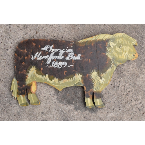 336 - Wooden Hereford bull sign with 'Champion Hereford Bull 1889' painted.