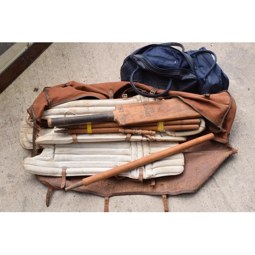 337 - A vintage cricket set to include stumps and pads etc together with cased sets of boules (3).