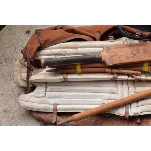 337 - A vintage cricket set to include stumps and pads etc together with cased sets of boules (3).