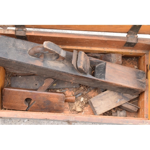 339 - A vintage 20th century pine tool box to include block planes and contents (Qty). 62 x 32 x 27cm.