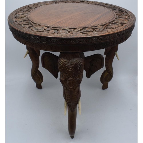 345 - Vintage Anglo-Indian occasional table with carved decoration and elephants heads for legs, 38cm tall... 