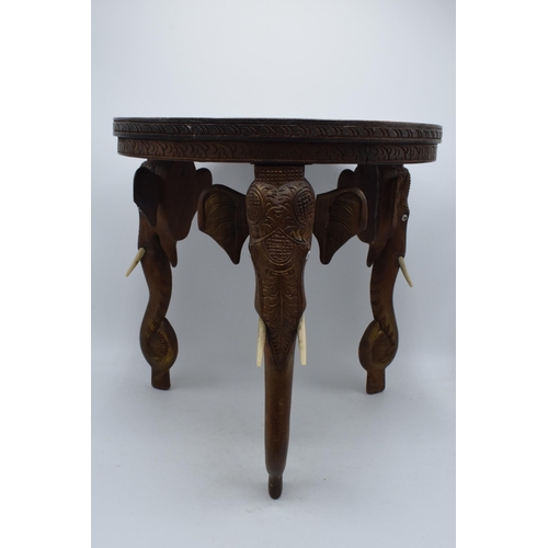 345 - Vintage Anglo-Indian occasional table with carved decoration and elephants heads for legs, 38cm tall... 