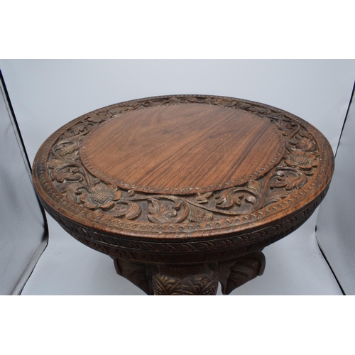 345 - Vintage Anglo-Indian occasional table with carved decoration and elephants heads for legs, 38cm tall... 