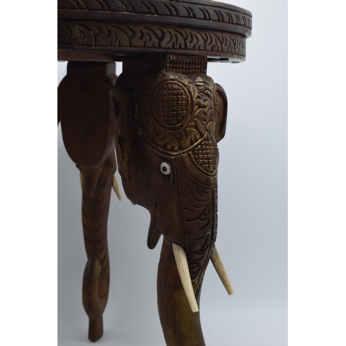 345 - Vintage Anglo-Indian occasional table with carved decoration and elephants heads for legs, 38cm tall... 