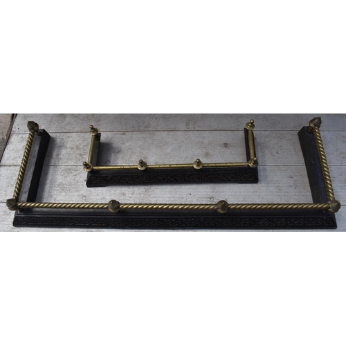 373 - A near pair of late 19th century metal and brass fire fenders, largest exteriors 145 x 50cm (2).