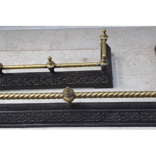 373 - A near pair of late 19th century metal and brass fire fenders, largest exteriors 145 x 50cm (2).