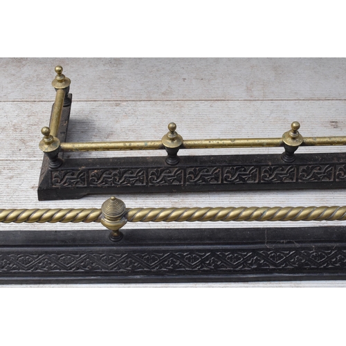 373 - A near pair of late 19th century metal and brass fire fenders, largest exteriors 145 x 50cm (2).