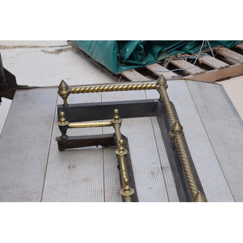 373 - A near pair of late 19th century metal and brass fire fenders, largest exteriors 145 x 50cm (2).