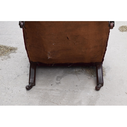 374 - 19th century upholstered mahogany button-back library-style chair, 94cm tall. In need of attention.