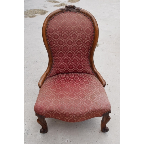 376 - 19th century / Edwardian upholstered nursing chair, 88cm tall, carved decoration to the top.