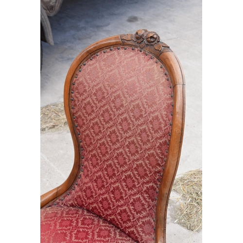 376 - 19th century / Edwardian upholstered nursing chair, 88cm tall, carved decoration to the top.