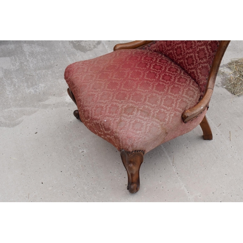 376 - 19th century / Edwardian upholstered nursing chair, 88cm tall, carved decoration to the top.