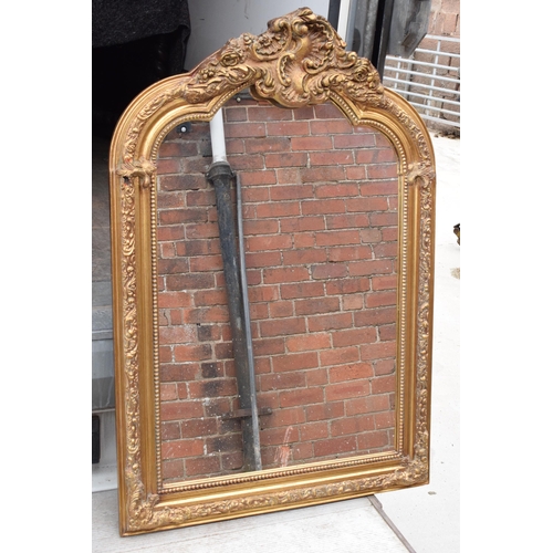 379 - A large vintage gilt-style hanging over mantle mirror, 118cm tall.