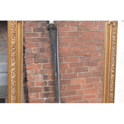 379 - A large vintage gilt-style hanging over mantle mirror, 118cm tall.