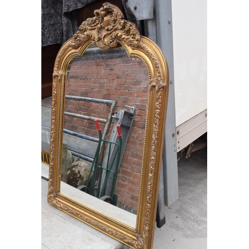 379 - A large vintage gilt-style hanging over mantle mirror, 118cm tall.