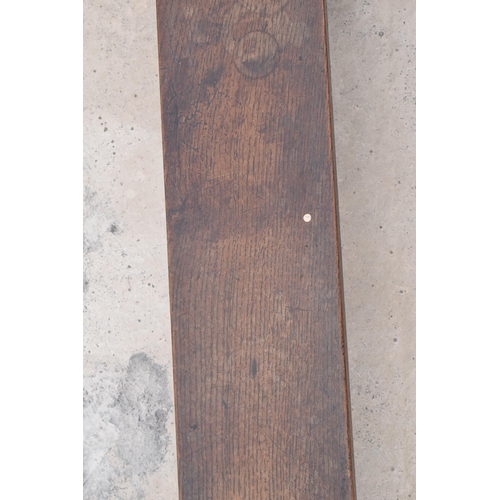 387 - Victorian oak elongated foot stool, 126cm long, 22cm tall.