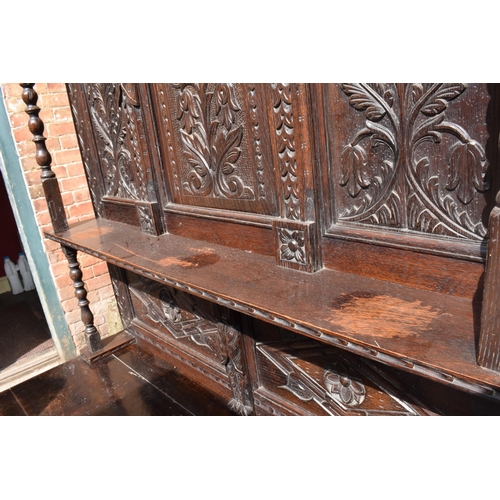 391 - 19th century dresser with carved decoration in a Jacobean manner, probably European. 120 x 56 x 202c... 