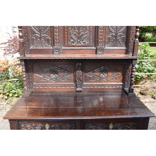 391 - 19th century dresser with carved decoration in a Jacobean manner, probably European. 120 x 56 x 202c... 