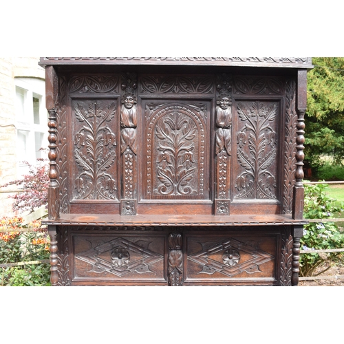 391 - 19th century dresser with carved decoration in a Jacobean manner, probably European. 120 x 56 x 202c... 