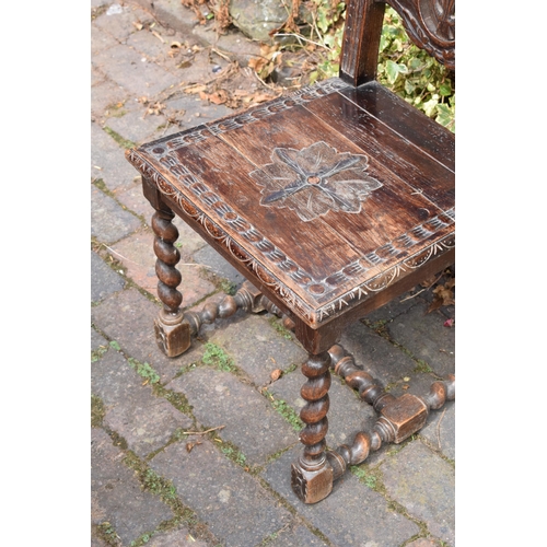 394 - Late 18th / early 19th century carved chair, gothic style, 106cm tall.