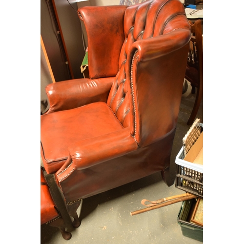 397 - Vintage button back oxblood red leather wingback Chesterfield chair together with footstool, chair 1... 