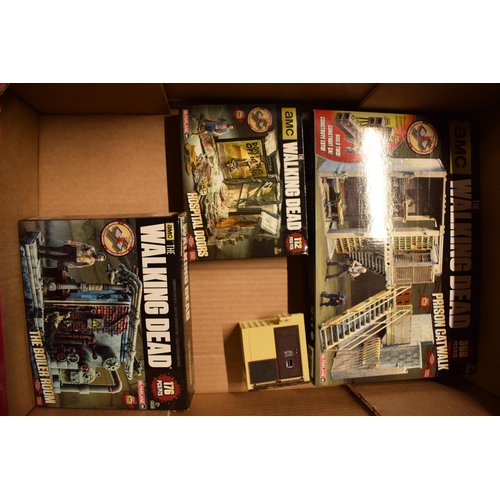 405 - A collection of toys / models to include AMC Walking Dead construction sets and other similar loose ... 