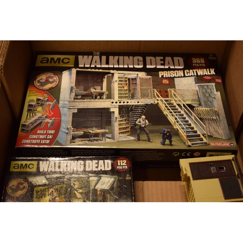 405 - A collection of toys / models to include AMC Walking Dead construction sets and other similar loose ... 