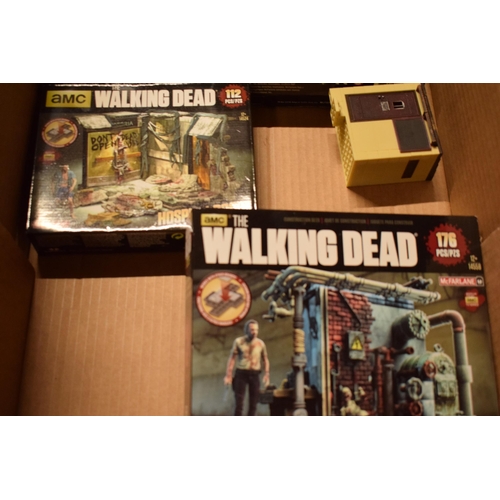 405 - A collection of toys / models to include AMC Walking Dead construction sets and other similar loose ... 