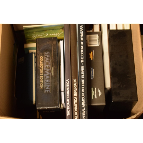 414 - A large collection of Warhammer and similar model gaming books to include guides, magazines, books a... 