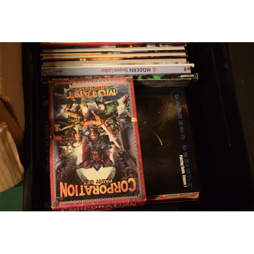 414 - A large collection of Warhammer and similar model gaming books to include guides, magazines, books a... 