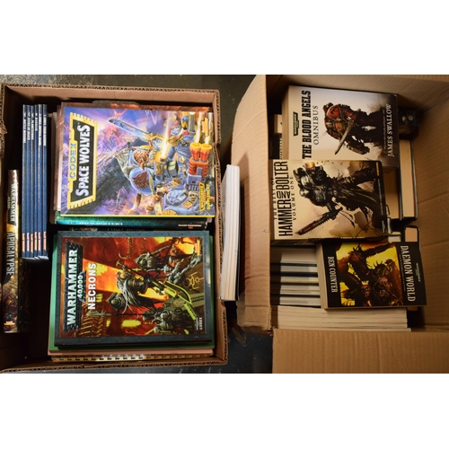 425 - A large collection of books to include Warhammer 40,000 examples, Codex Space Wolves, Hammer and Bol... 