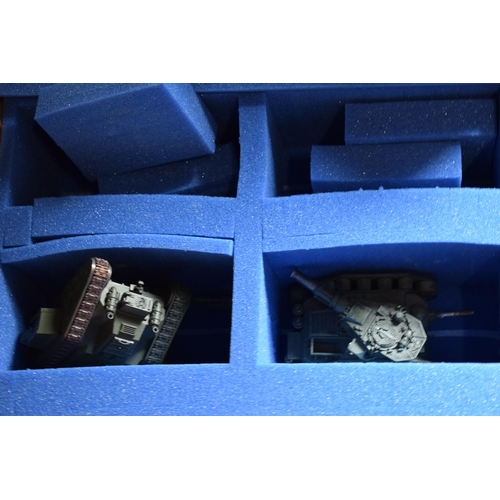 429 - A collection of Warhammer vehicles of varying forms in cardboard carry cases (Qty).